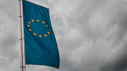 EU flag with cloudy background