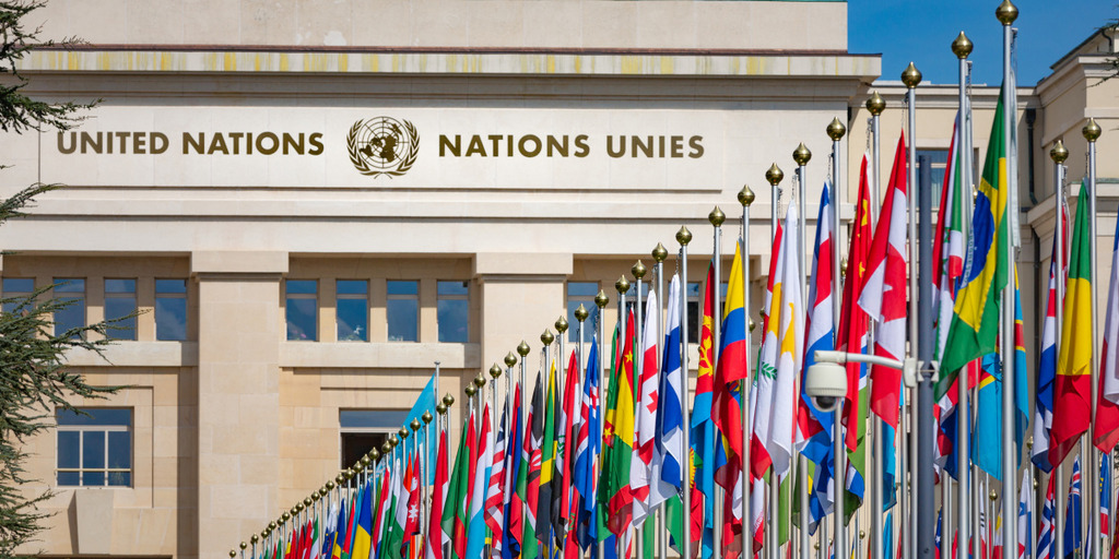 [Translate to English:] United Nations Building and the flags in Geneva Switzerland