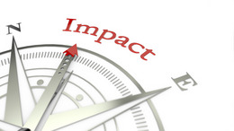 Kompassnadel zeigt auf das Wort Impact