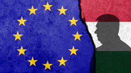 Europe Union and Hungary flags painted on the concrete wall.