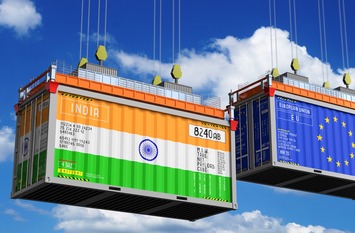 Shipping containers with flags of India and Europe