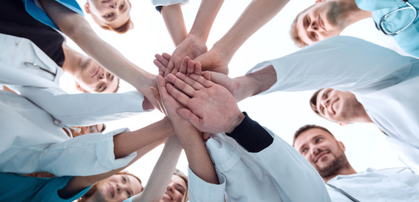 bottom view. a group of medical colleagues putting their hands together.(© © ASDF - stock.adobe.com)