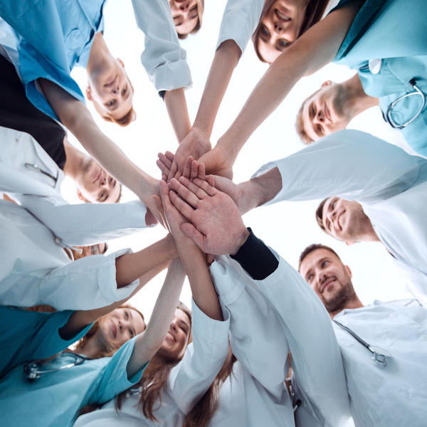 bottom view. a group of medical colleagues putting their hands together.(© © ASDF - stock.adobe.com)