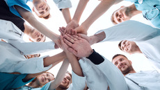 bottom view. a group of medical colleagues putting their hands together.(© © ASDF - stock.adobe.com)