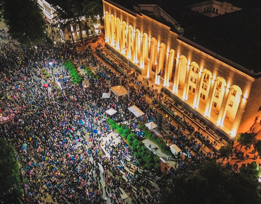 Bird's-eye view of the square in front of the Georgian parliament in Tbilisi, where many protesters are assembled.