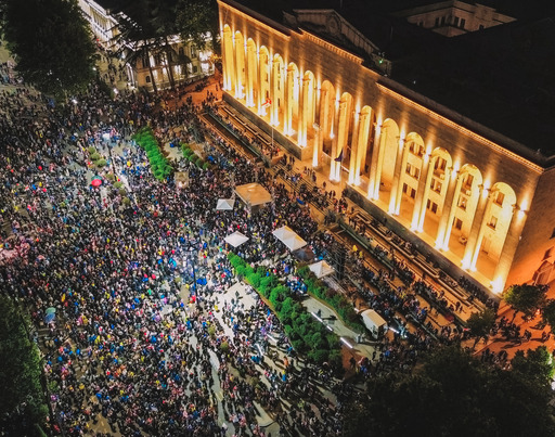 Bird's-eye view of the square in front of the Georgian parliament in Tbilisi, where many protesters are assembled.