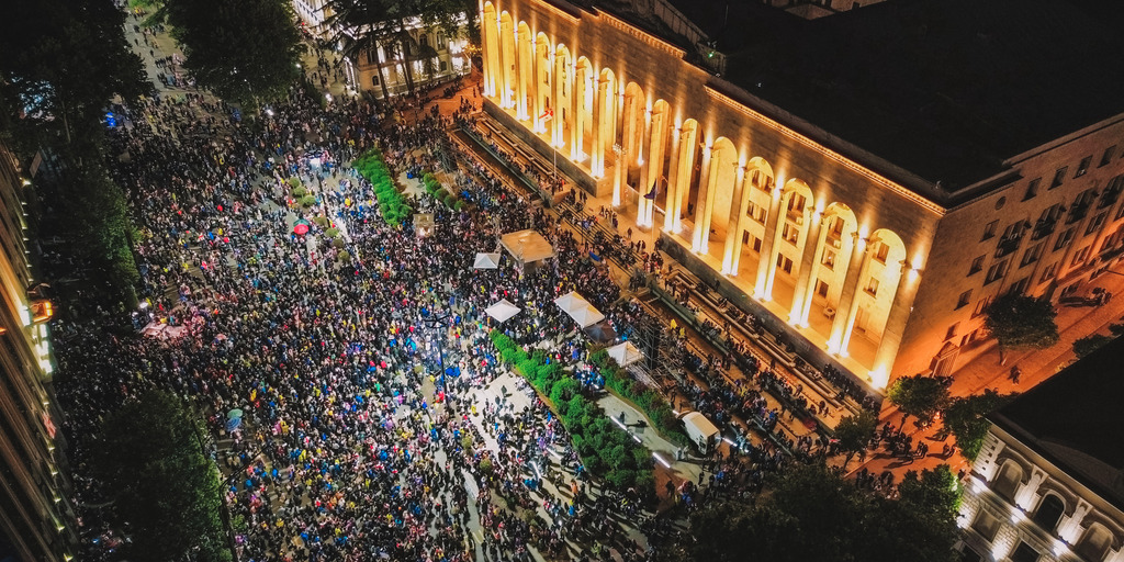 Bird's-eye view of the square in front of the Georgian parliament in Tbilisi, where many protesters are assembled.