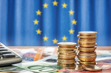 Money in front of the European flag.