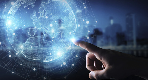 Businessman hand in dark using Europe map globe network hologram