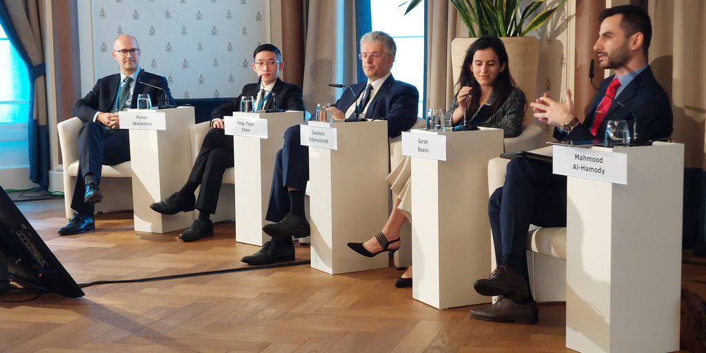 The podium with 5 panelists