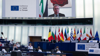 Citizens discussing during the Conference on the Future of Europe in the plenary hall of the European Parliament in Strasbourg.