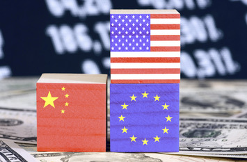 Dollars and flags of Amerika, China and the European Union