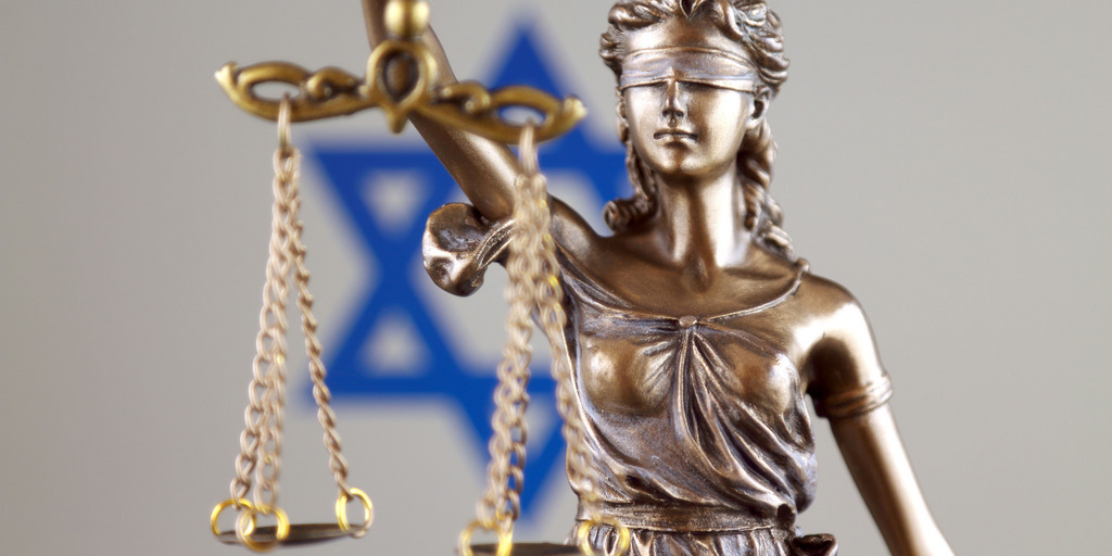 Symbol of law and justice with Israel Flag. Close up.