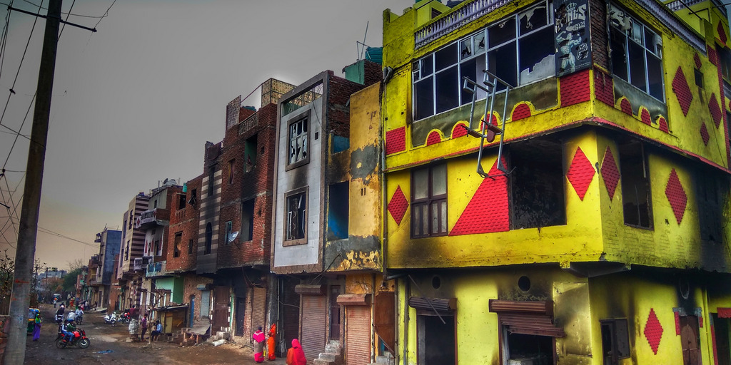 Burnt buildings after riots in Delhi