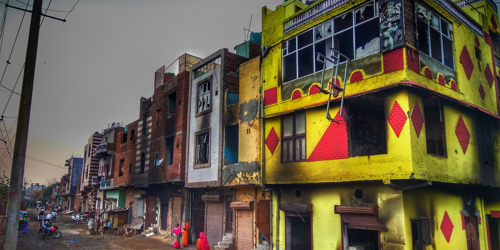 Burnt buildings after riots in Delhi