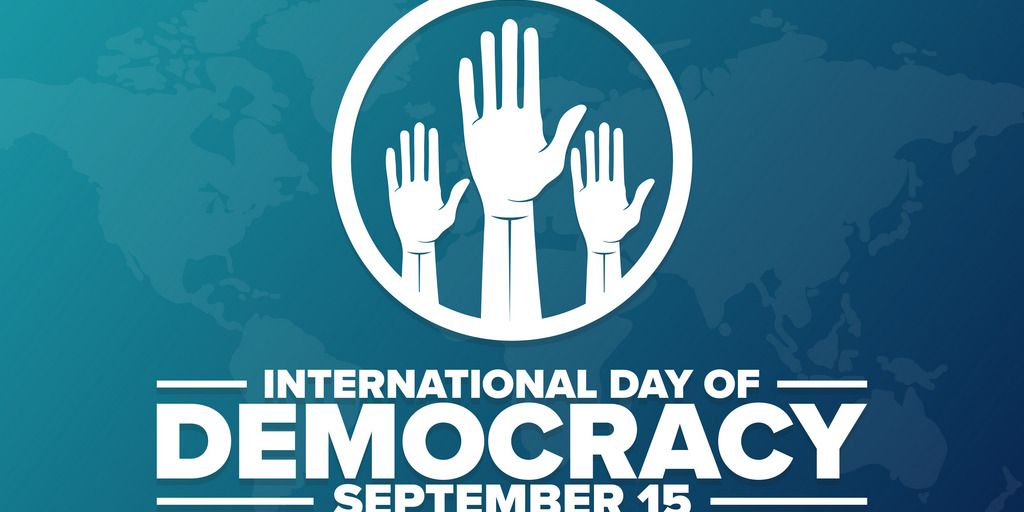 Raising hands for International Day of Democracy on September 15