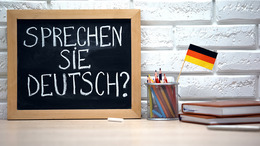 kleine Tafel mit dem Schriftzug "Sprechen Sie Deutsch?"