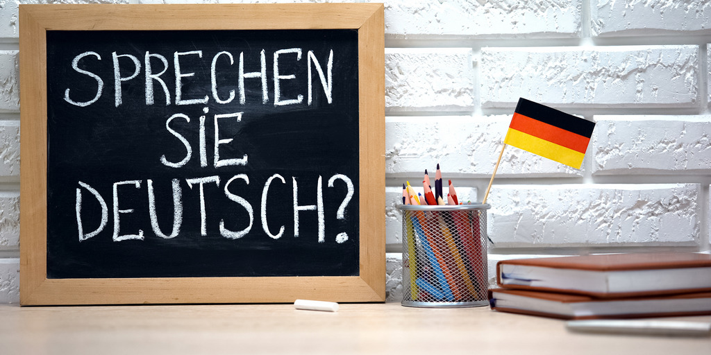 kleine Tafel mit dem Schriftzug "Sprechen Sie Deutsch?"
