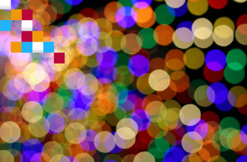 Ganz viele bunte Kreise auf einem schwarzen Hintergrund zu sehen