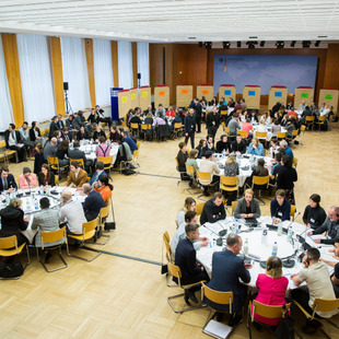 Citizens discuss at round tables