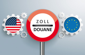 Neben einem Schild, das auf eine Zollkontrollstelle hinweist, sind mehrere Zahnräder zu sehen, in den zwei größten Zahnrädern sind die Flaggen der USA und der EU zu sehen.