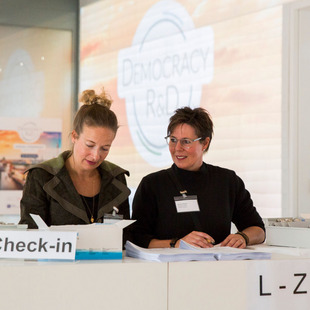 Two women at the check in desk