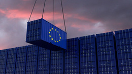 A freight container with the EU flag hangs in front of many blue stacked freight containers - concept trade - import and export