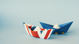 Paper ships from the flags of the European Union and the UK