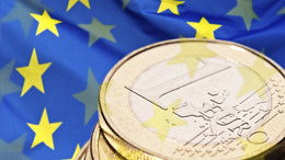 Euro coin and flag of Europe