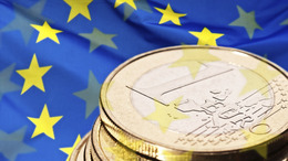 Euro coin and flag of Europe
