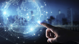Businessman hand in dark using Europe map globe network hologram