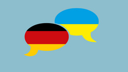 zwei Sprechblasen, eine mit deutscher Flagge und eine in ukrainischer Flagge, nebeneinander