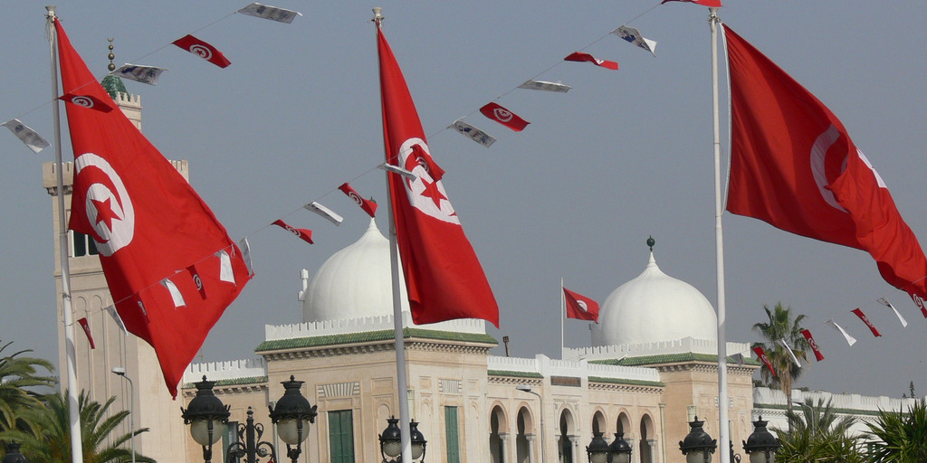 Government building in Tunis, Tunisia, with Tunisian flags all around.