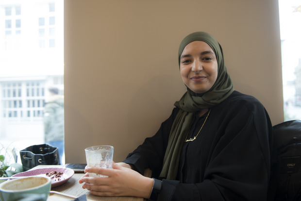 Young woman with a headscarf in a café