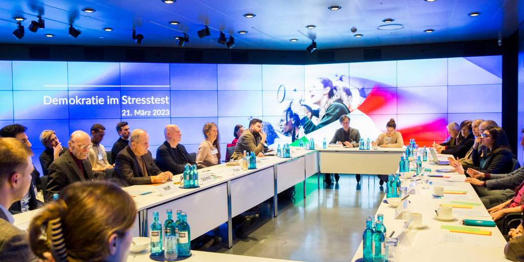 Participants discussing at the table