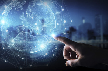 Businessman hand in dark using Europe map globe network hologram