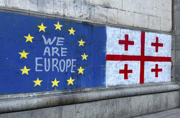 Flags of Europe and Georgia as Graffiti on a Wall