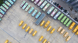 Top-down aerial view into a bus depot