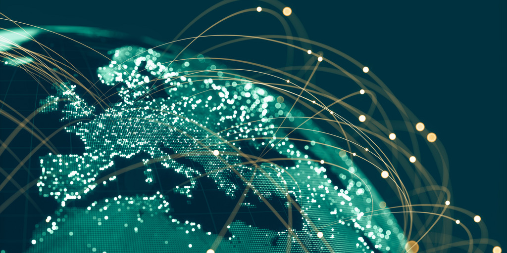 You can see a section of the globe in front and in the back the dark blue black night sky. The continents are dark green, the seas are blue-black, almost like the sky and around the globe are round stripes of light, yellowish light
