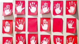 White hands on red paper