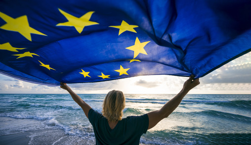 Woman holding the European Flag