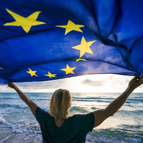 Woman holding the European Flag