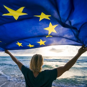 Woman holding the European Flag