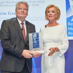 Liz Mohn, Vice Chairman of the Bertelsmann Stiftung Executive Board, presents the Reinhard Mohn Prize to former German President Joachim Gauck on the stage of the Gütersloh Theatre.