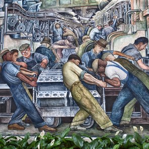"Gemaltes Bild auf einer Wand in Detroit. Darauf sind Arbeitern bei Ihrer Tätigkeit in einer Autofabrik zu sehen"